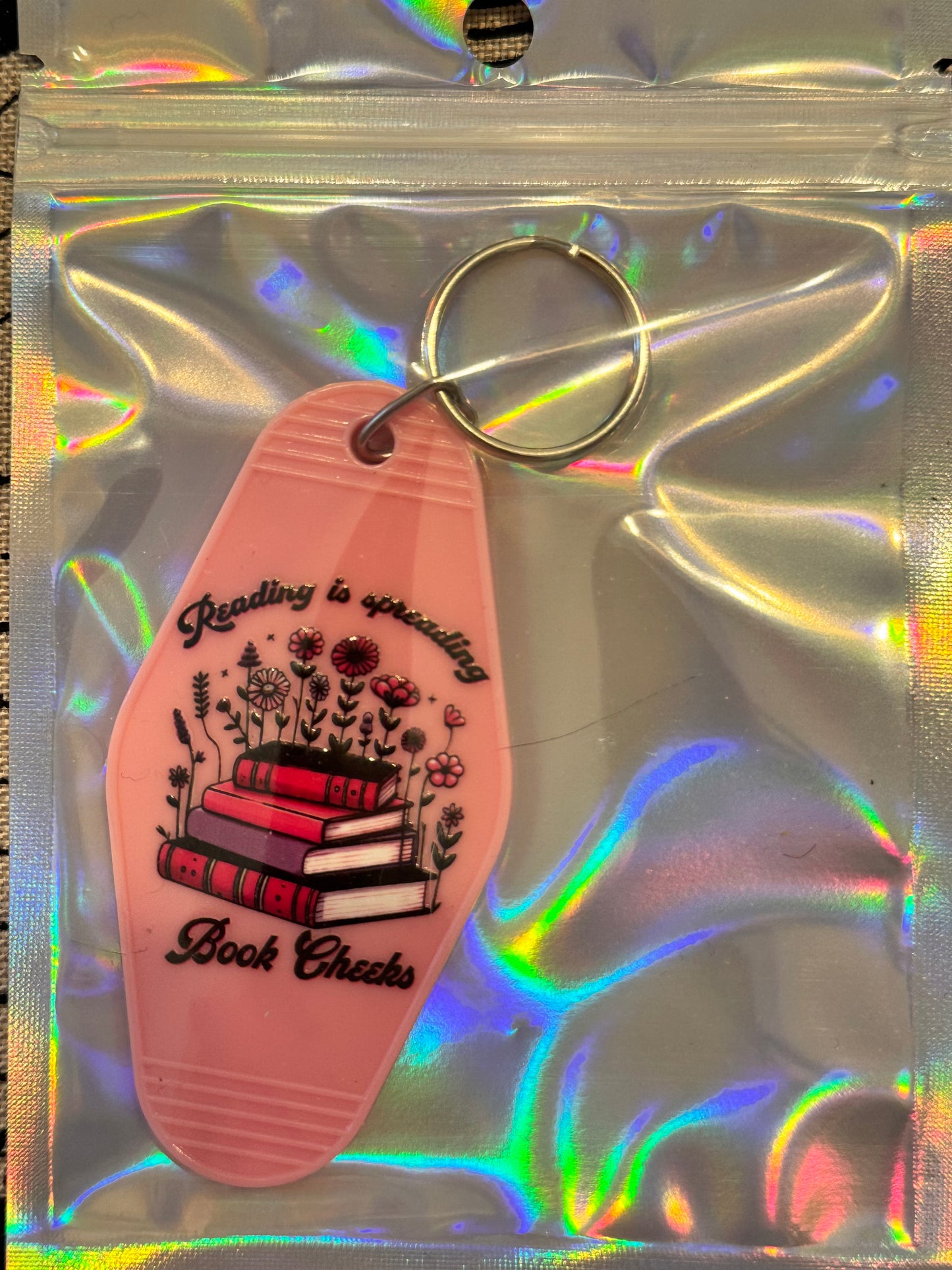 Reading Is Spreading Book Cheeks – Motel-Style Bookish Keychain